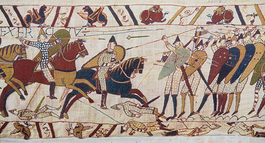 BAYEUX, FRANCE - FEB 12: Detail of the Bayeux Tapestry depicting the Norman invasion of England in the 11th Century on February 12, 2013